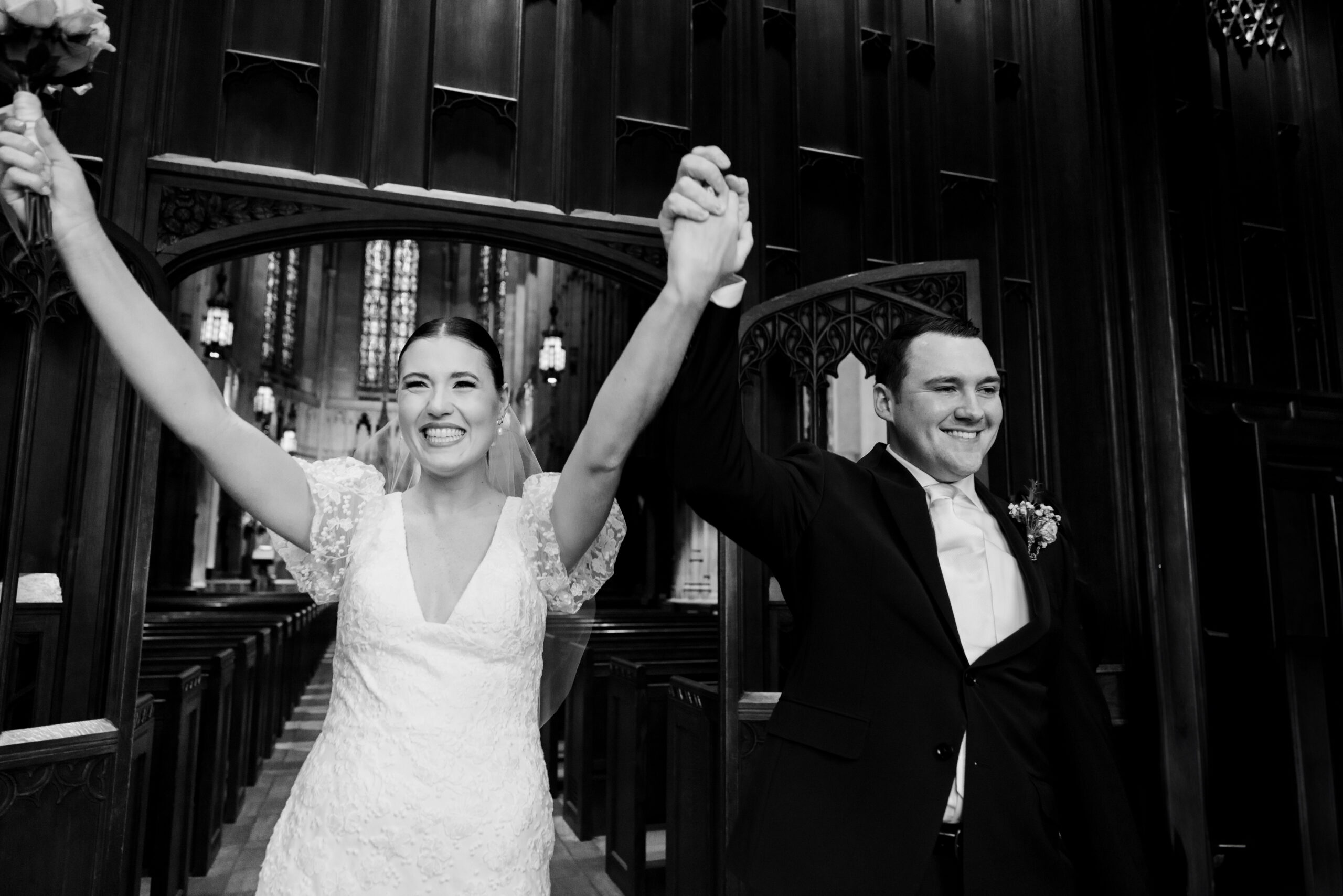 Groom and bride celebrate with family and friends as their exit Heinz Chapel in Pittsburgh on their wedding day. Photo taken by Pittsburgh Wedding Photographer Aaron Aldhizer
